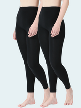 Two pairs of black leggings worn by models on a light gray background
