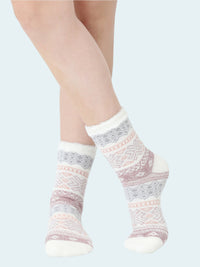 Pair of patterned socks worn on a white background