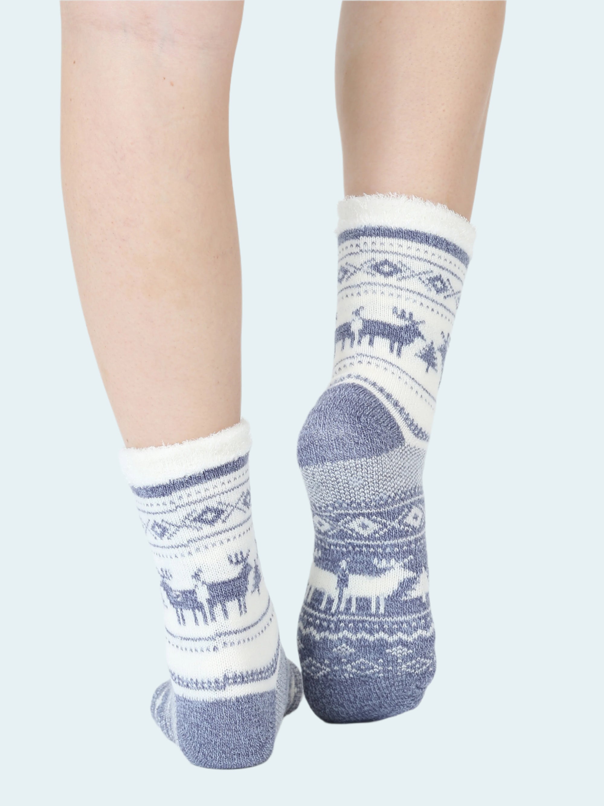 White socks with blue patterns featuring deer on a white background