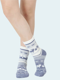 Person wearing blue and white patterned socks on a light gray background