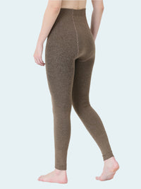 Brown leggings worn by a person on a white background