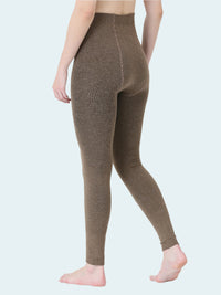 Brown leggings worn by a person on a white background
