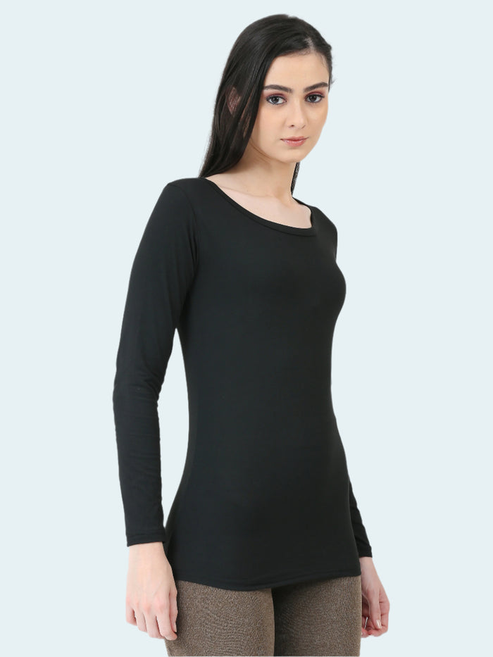 A woman wearing a long-sleeved black base layer top.