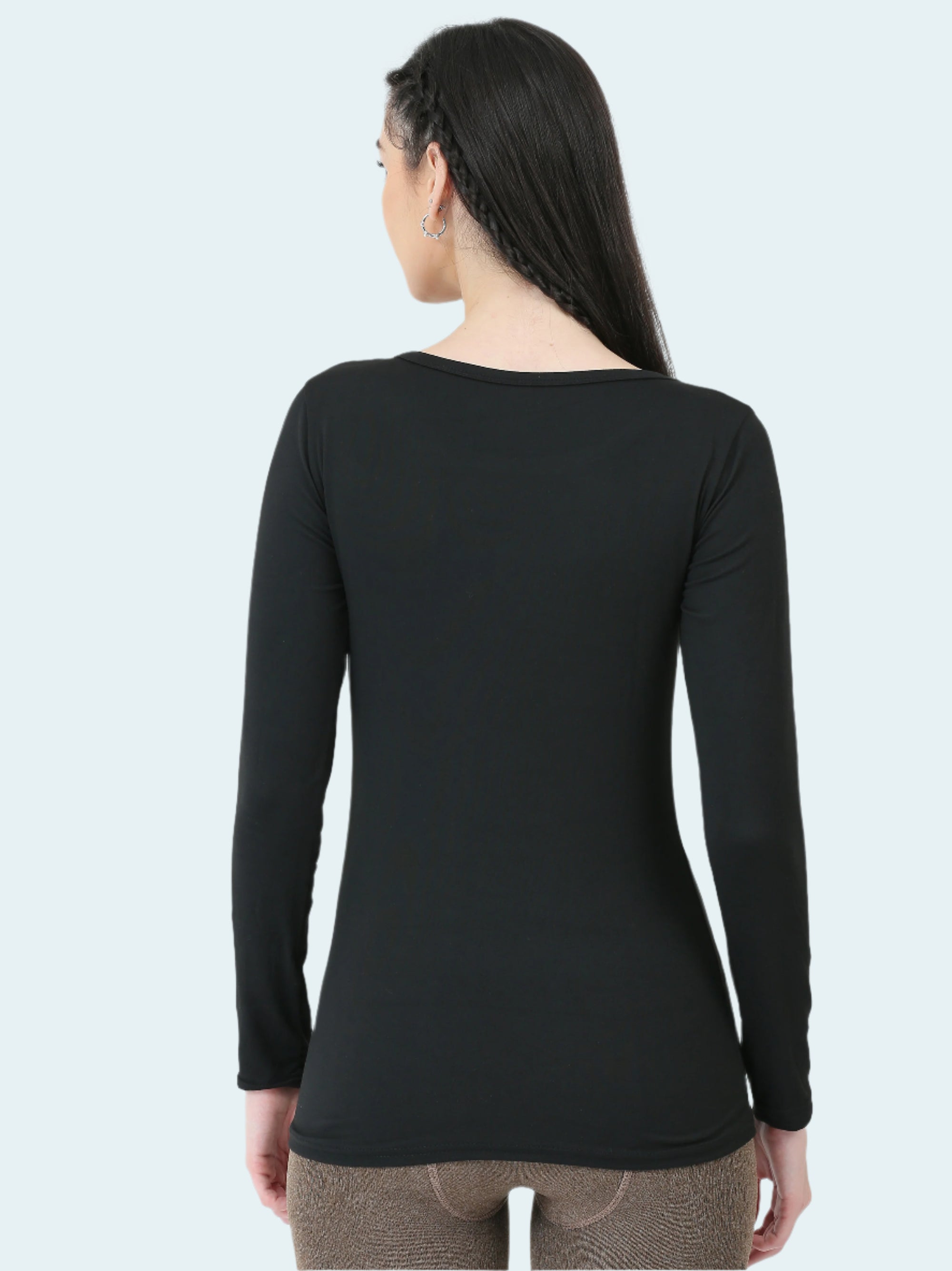 Person wearing a black long-sleeve shirt on a white background