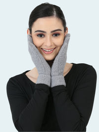 Woman wearing gray gloves on a white background