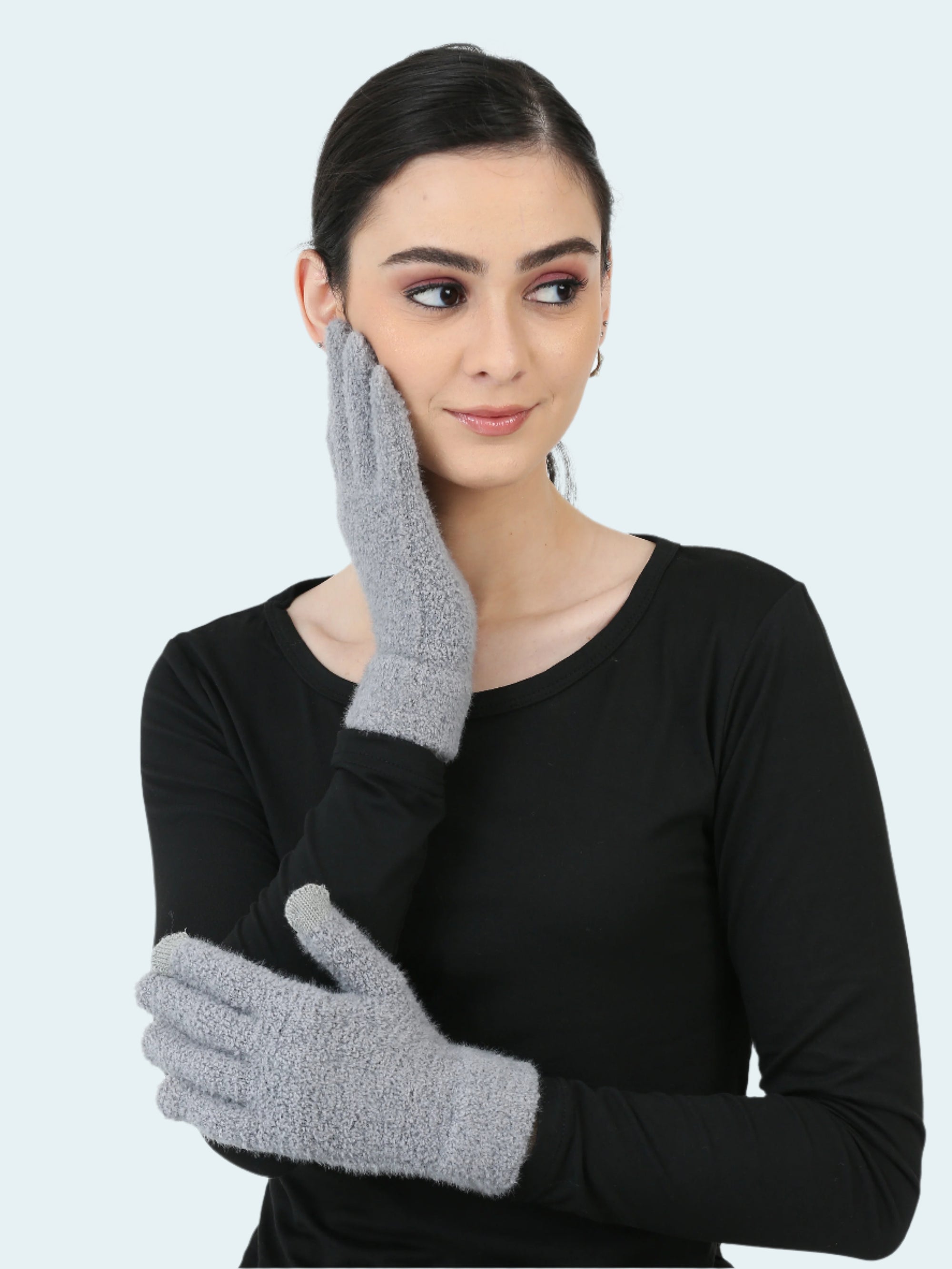 Woman wearing gray gloves on a white background