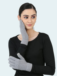 Woman wearing gray gloves on a white background