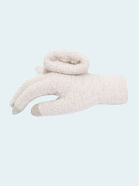 White fuzzy glove on a white background