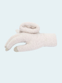 White fuzzy glove on a white background