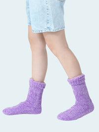 Purple chenille  socks worn by a person on a white background
