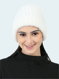 Woman wearing a white knitted hat on a white background