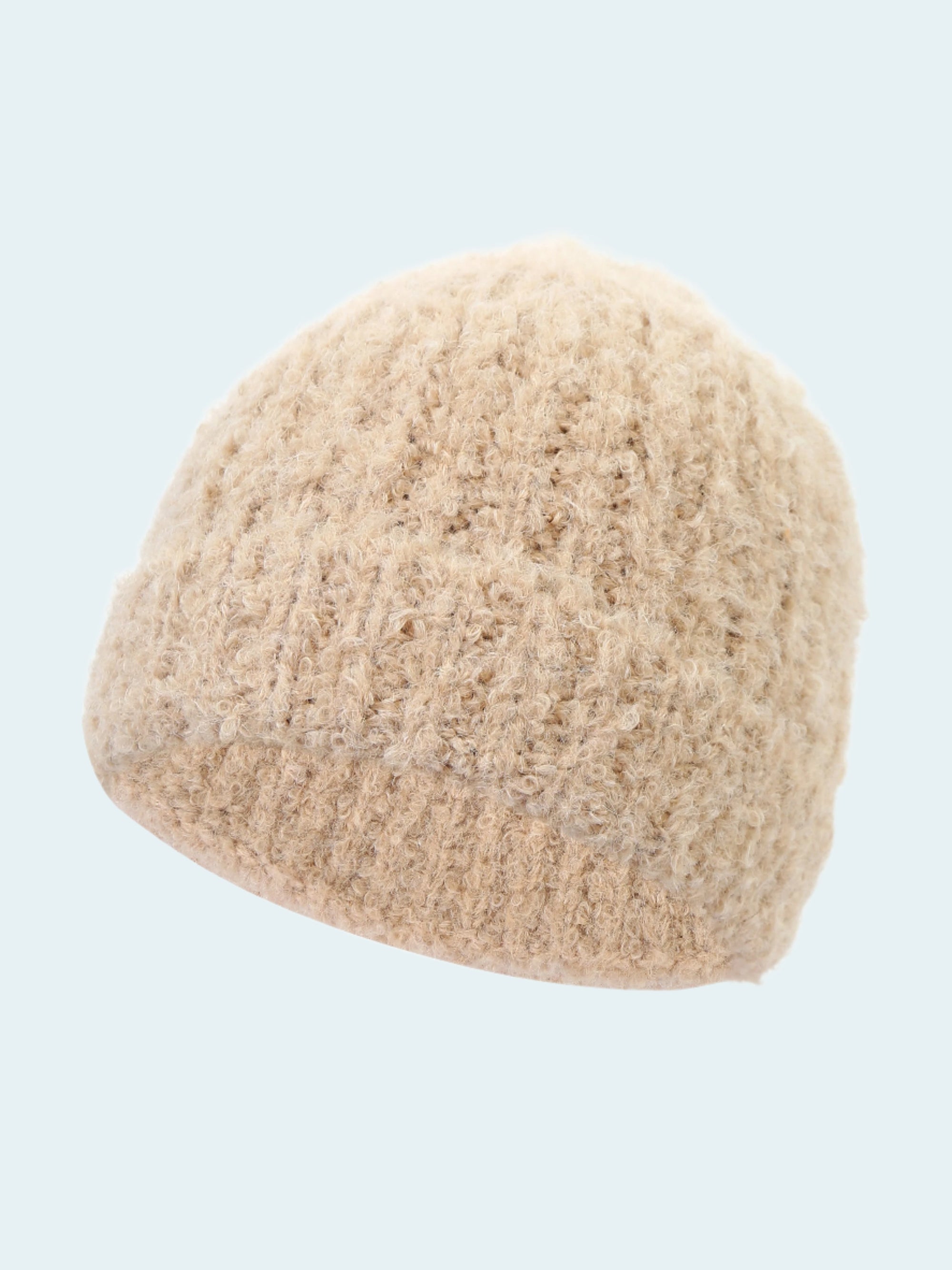 Beige knitted beanie on a white background