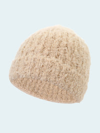 Beige knitted beanie on a white background