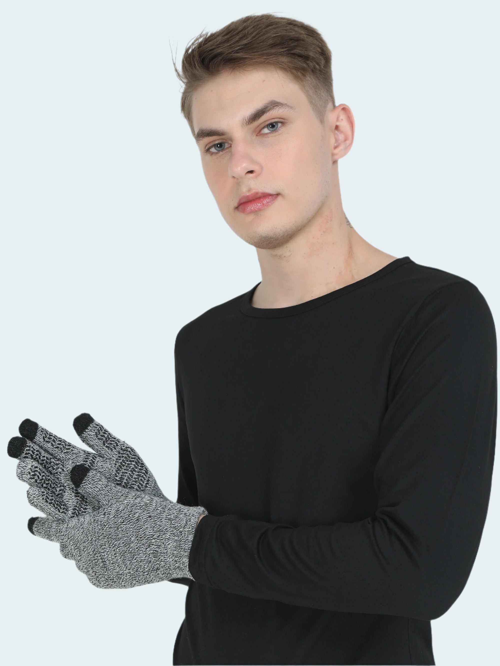 Person wearing a black long-sleeve shirt and gray gloves with black fingertips on a white background
