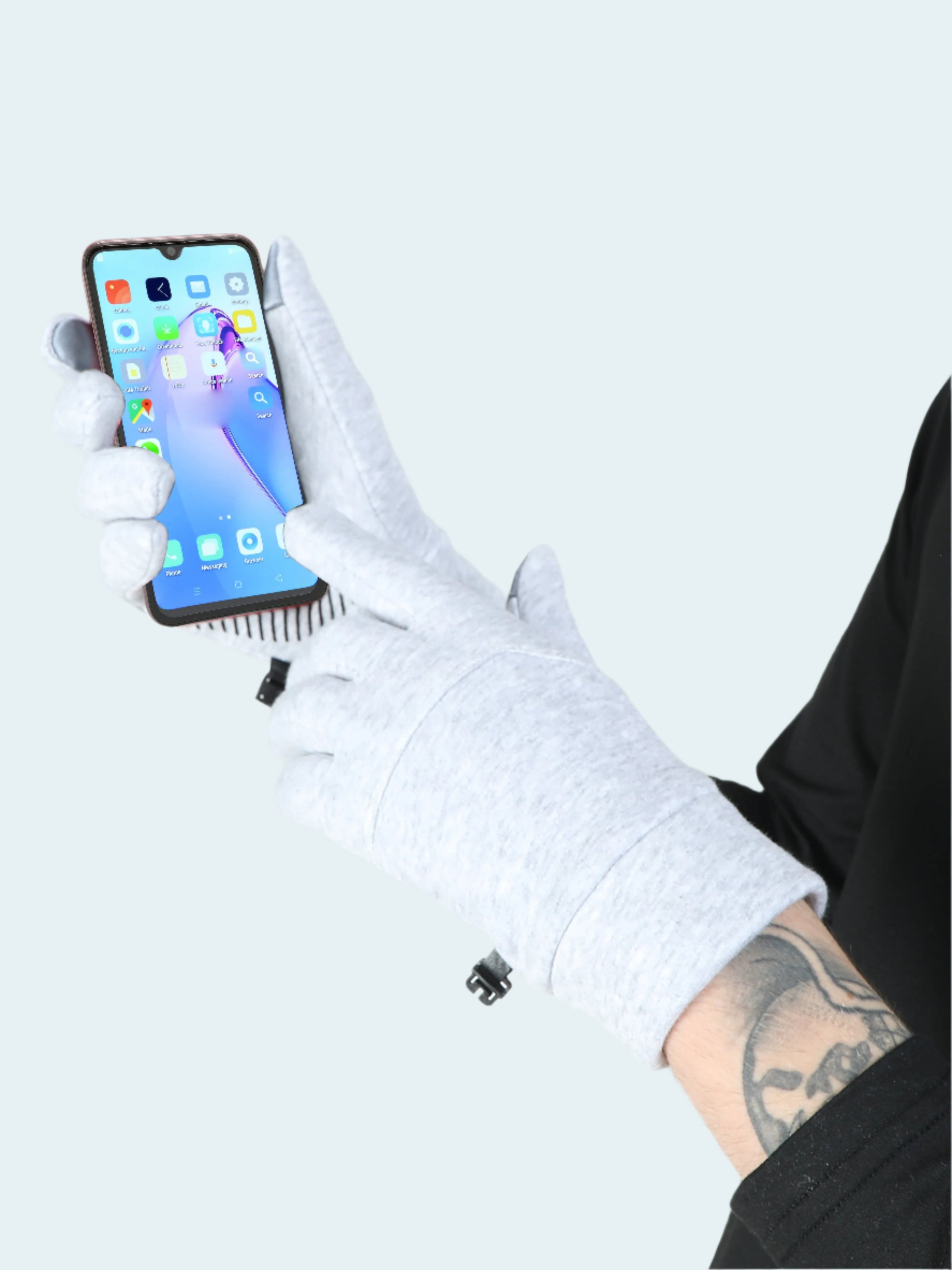 White glove holding a smartphone with a white background