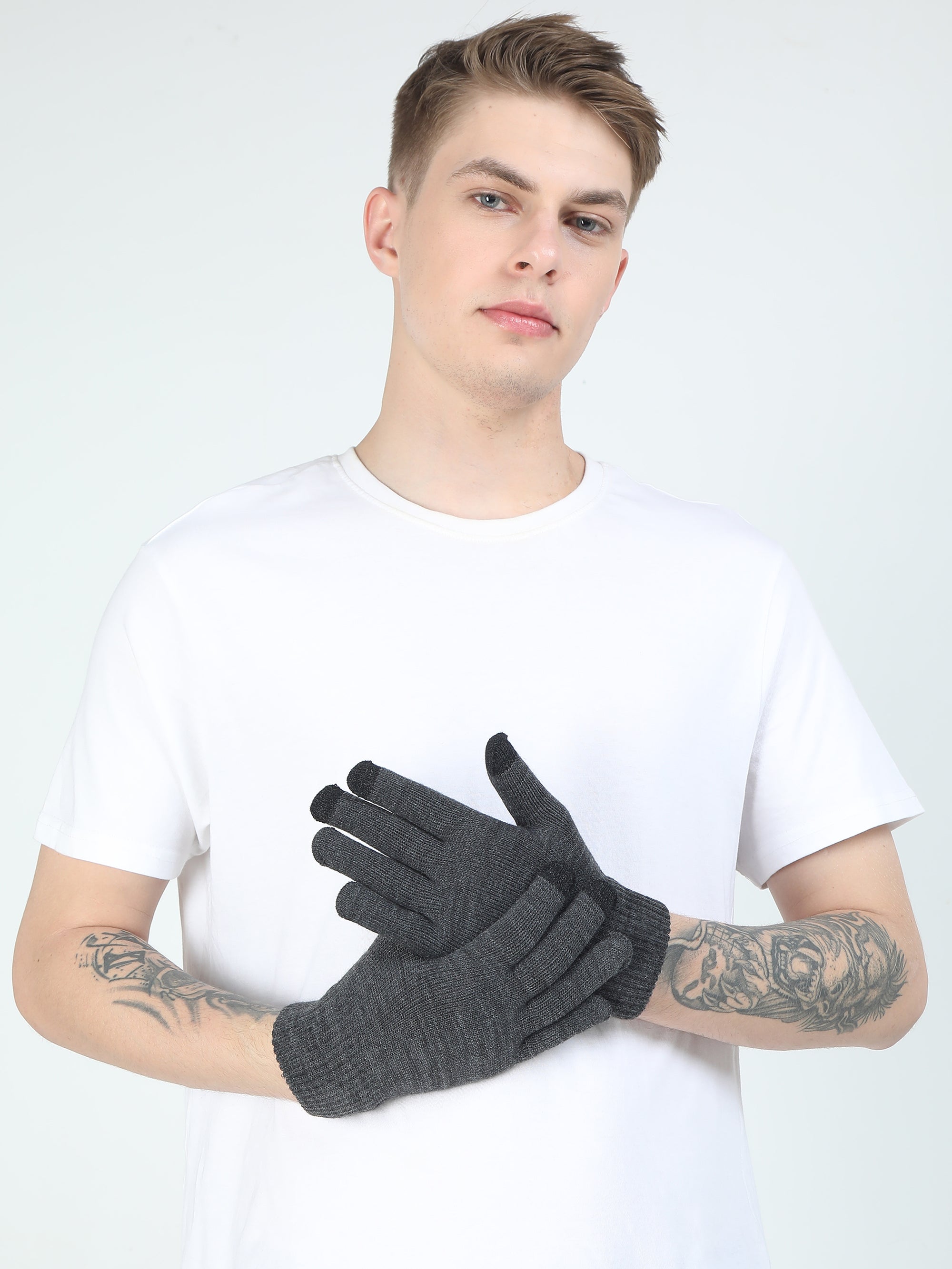 Person wearing gray gloves against a white background