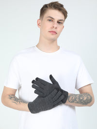 Person wearing gray gloves against a white background