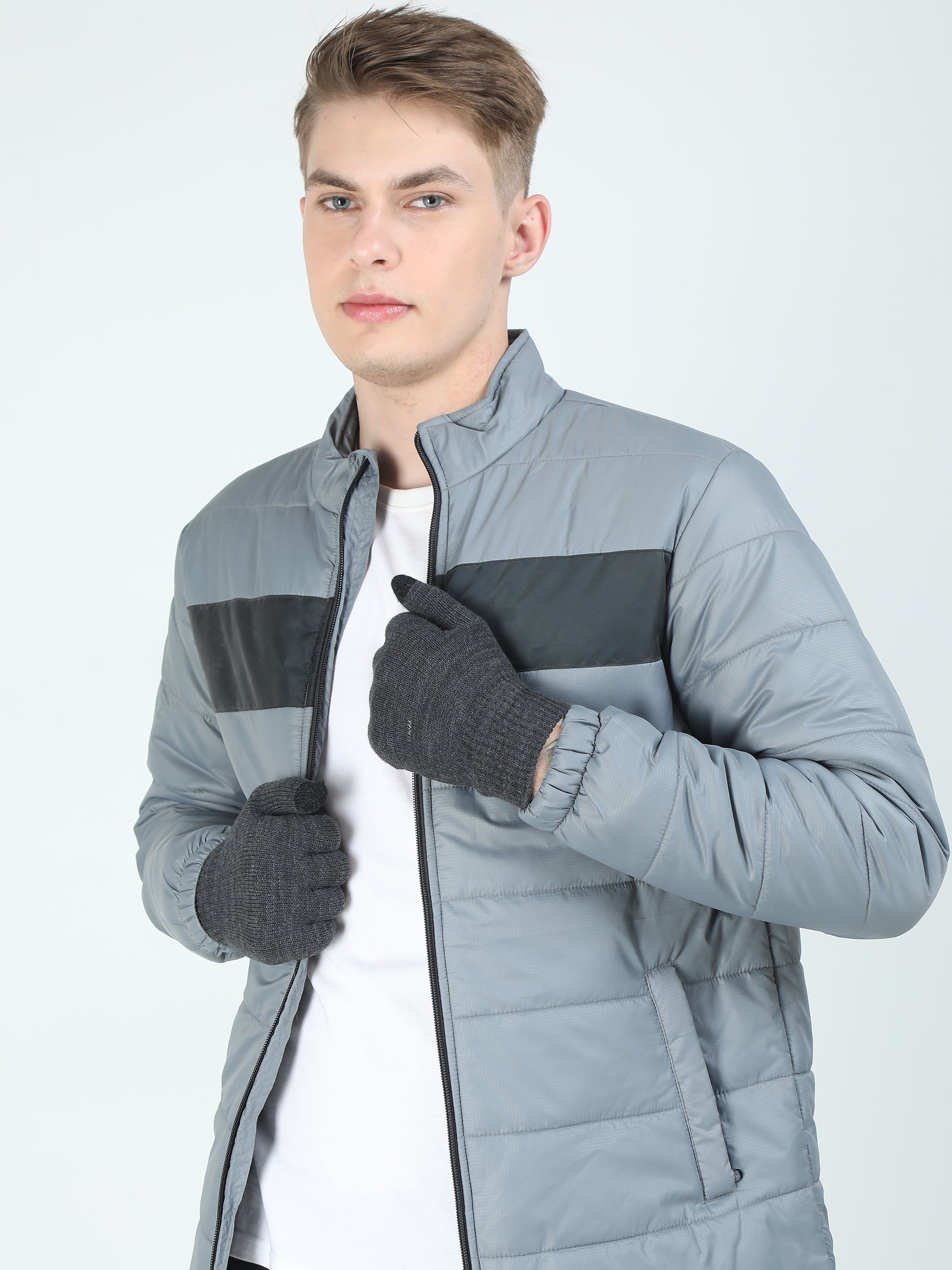 Man wearing a gray gloves on a white background