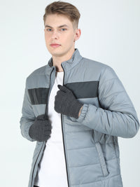 Man wearing a gray gloves on a white background