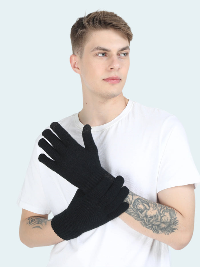 A person wearing a white t-shirt and black gloves with touchscreen compatible fingertips.