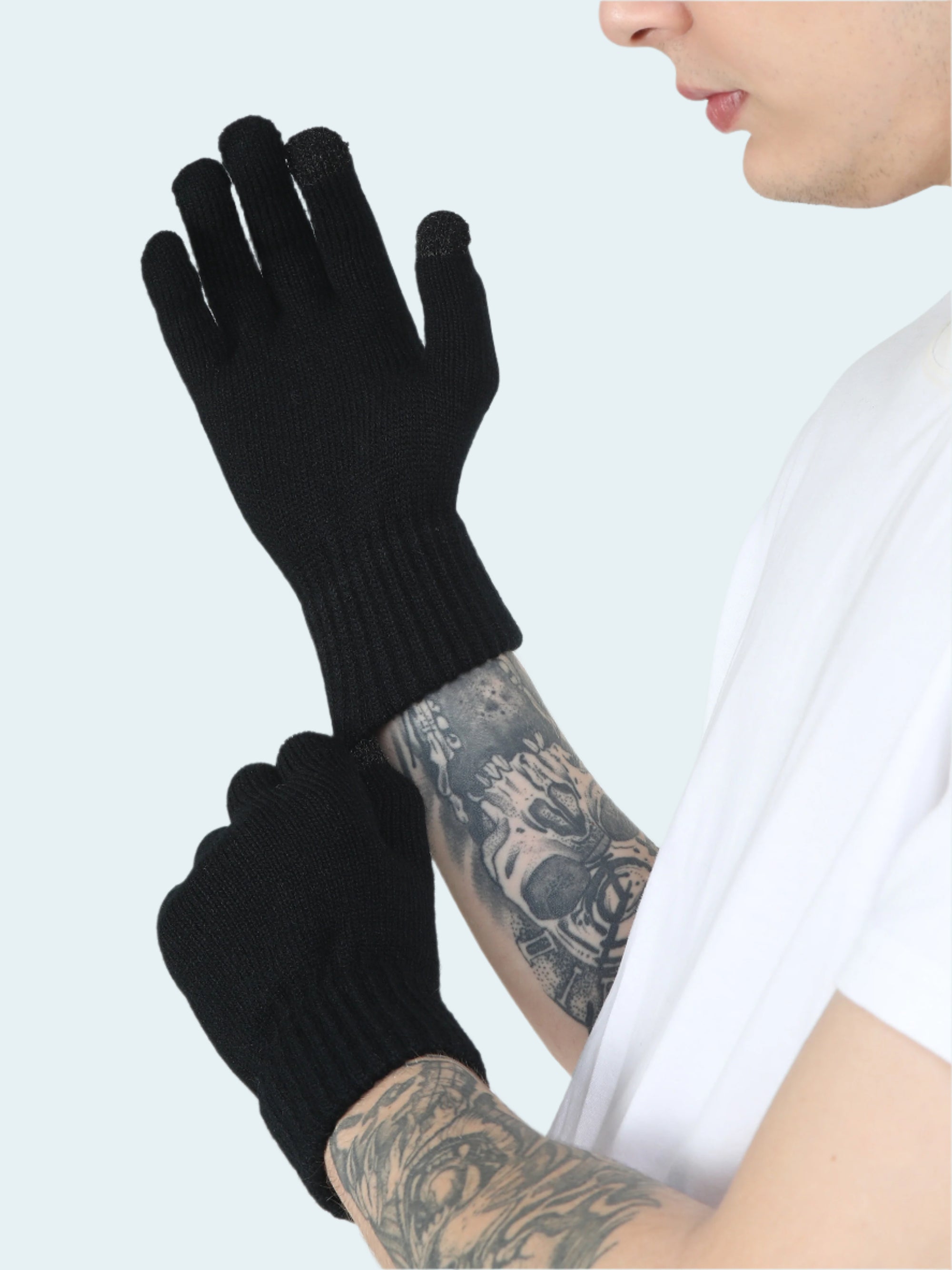Person wearing black gloves with a white background