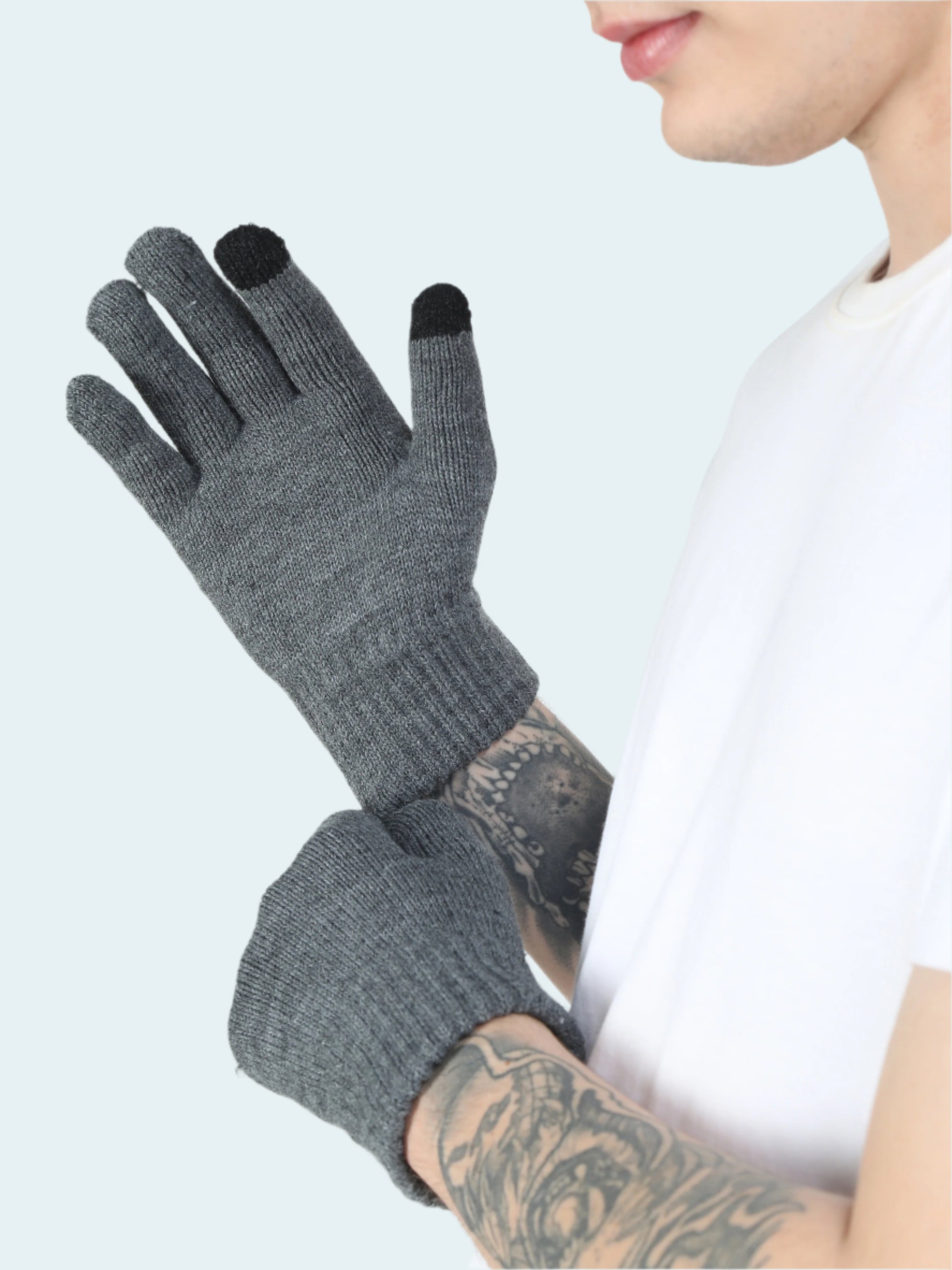 Person wearing gray gloves with black tips on a white background
