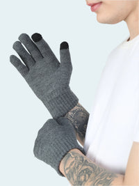 Person wearing gray gloves with black tips on a white background