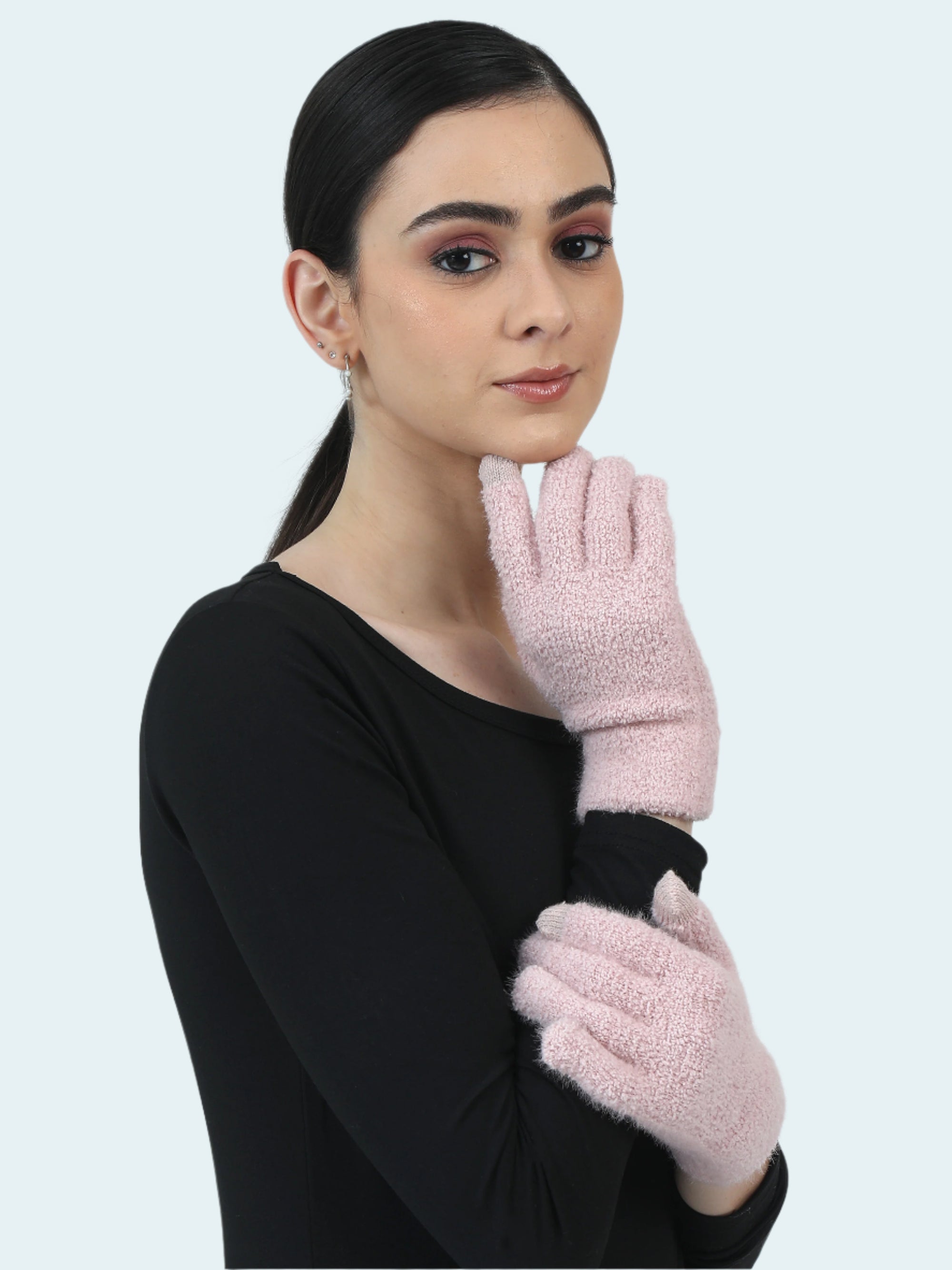 Woman wearing pink gloves against a light gray background