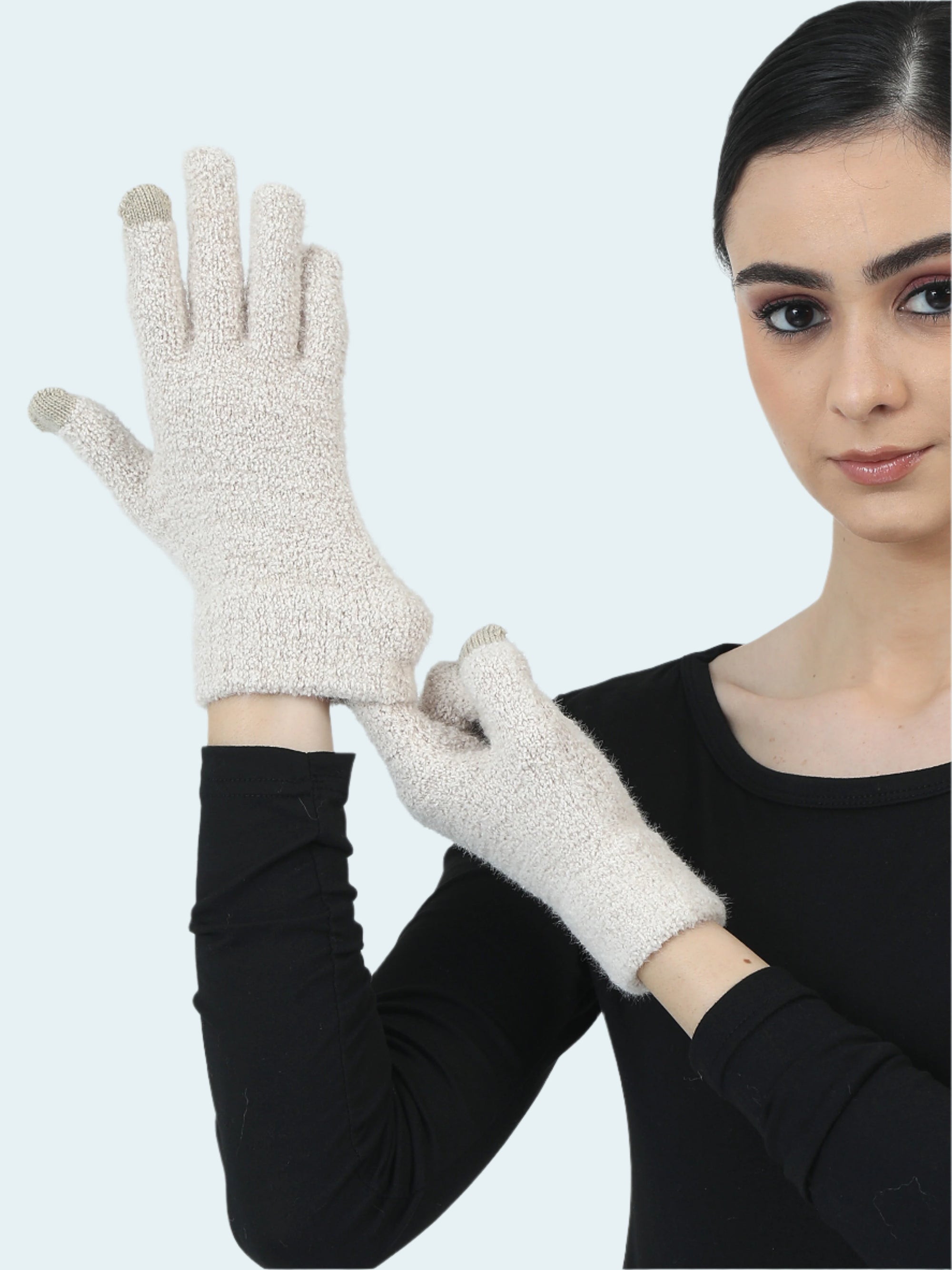 Woman wearing beige gloves against a light gray background
