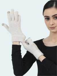 Woman wearing beige gloves against a light gray background
