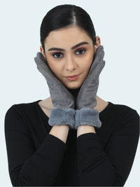 Woman wearing gray gloves against a light blue background