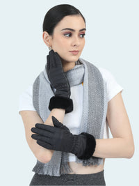 Woman wearing black gloves and a gray scarf on a white background