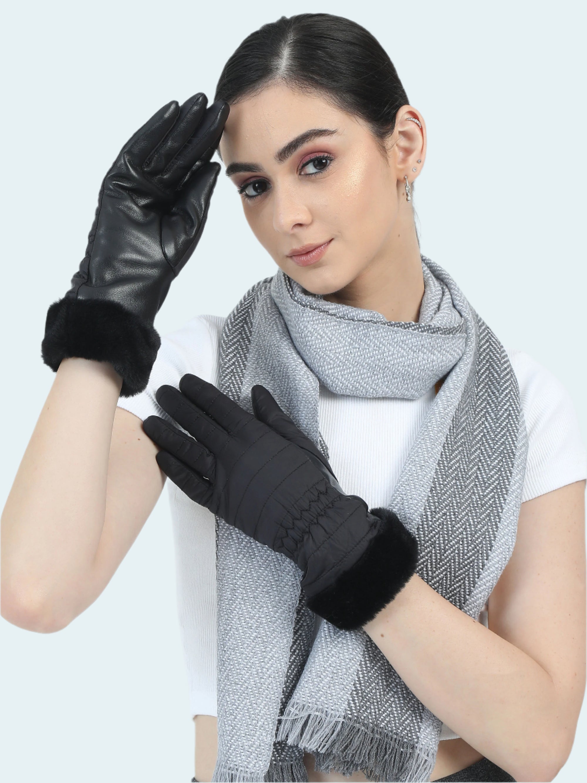 Woman wearing black gloves and a gray scarf on a white background