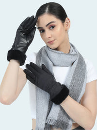 Woman wearing black gloves and a gray scarf on a white background
