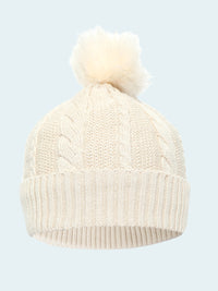 White knit beanie with pom-pom on a white background