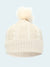 White knit beanie with pom-pom on a white background