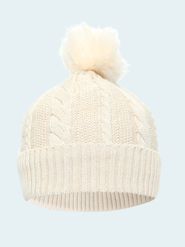 White knit beanie with pom-pom on a white background