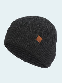 Black knit beanie with a brown logo patch on a white background
