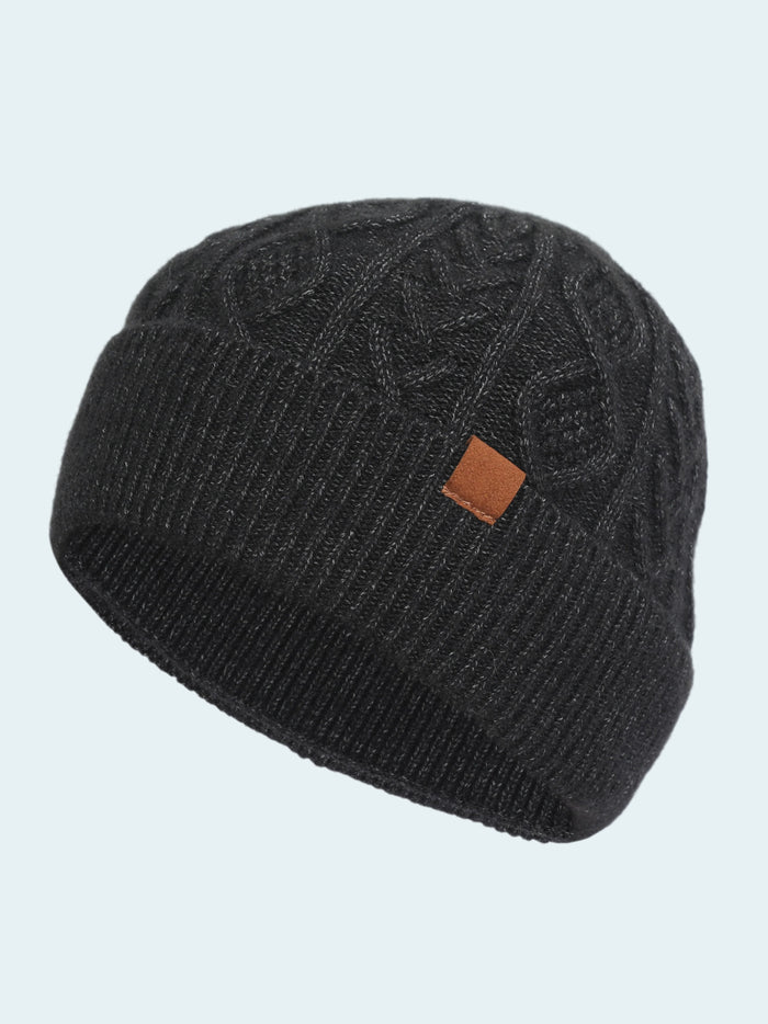 Black knit beanie with a brown logo patch on a white background