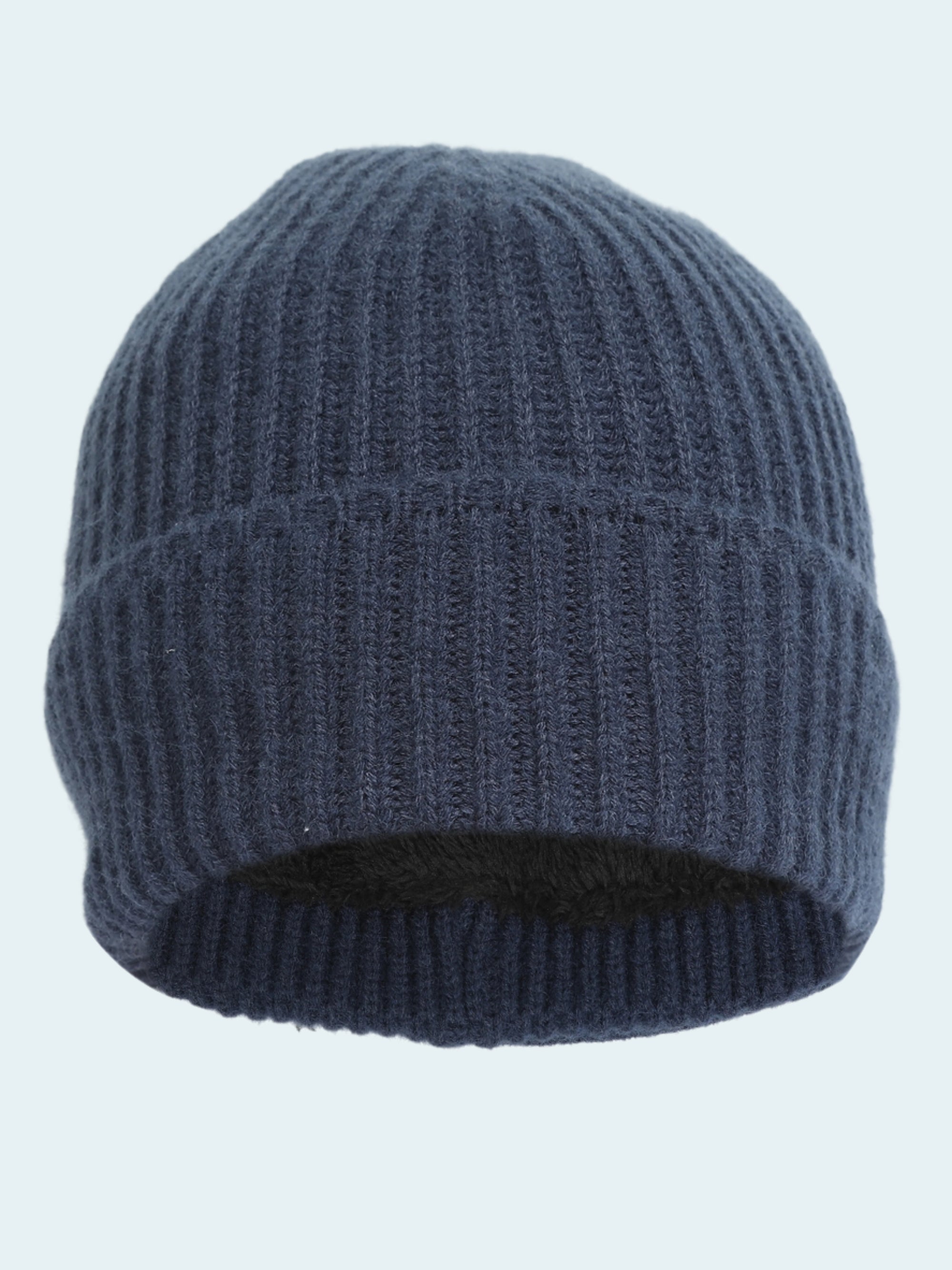 Blue knit beanie on a white background