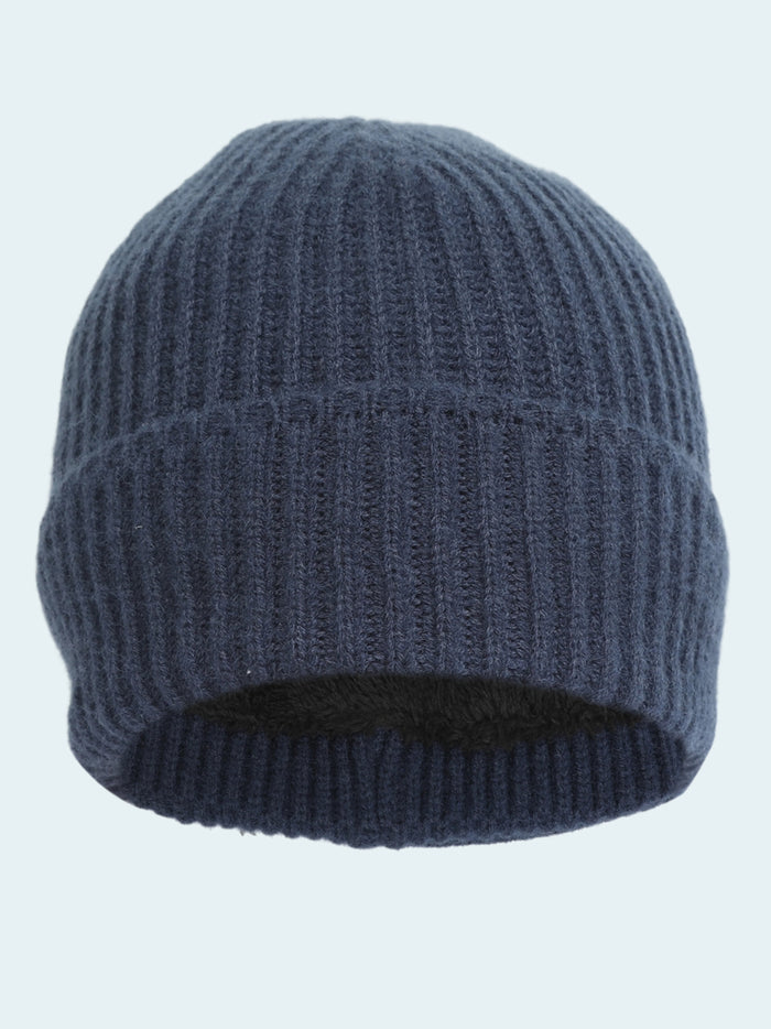 Blue knit beanie on a white background