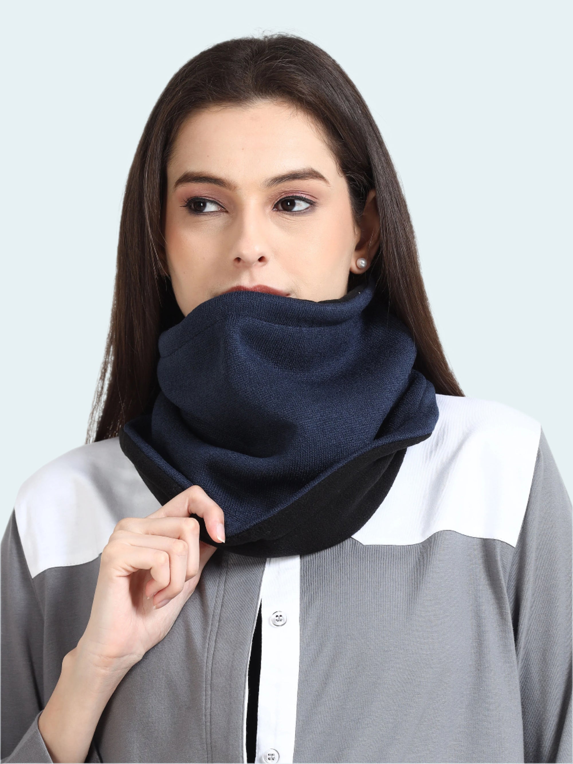 Woman wearing a navy blue gaiter around her neck.