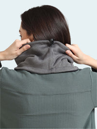 Person wearing a gray neck gaiter on a white background