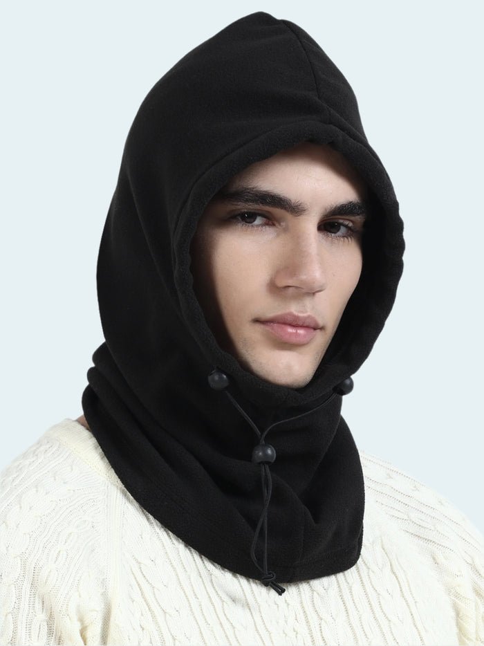 Person wearing a black hooded balaclava against a white background