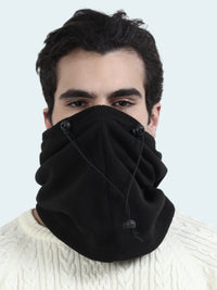 Person wearing a black balaclava with buttons on a white background