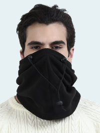 Person wearing a black balaclava with buttons on a white background