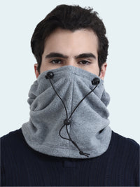 Person wearing a gray balaclava with black toggles on a white background