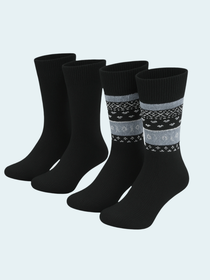 Set of black socks with patterned stripes on a light gray background