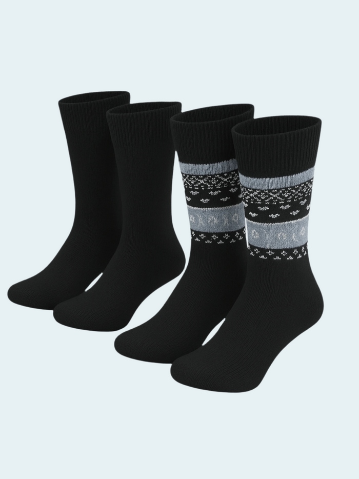 Set of black socks with patterned stripes on a light gray background