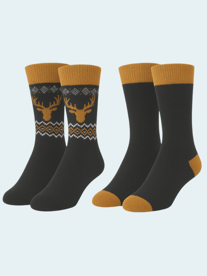 Four pairs of black socks with gold accents and deer designs on a light gray background